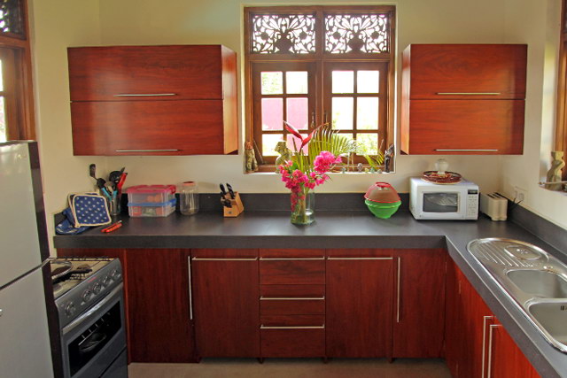 Kitchen with mahogany cupboards etc.